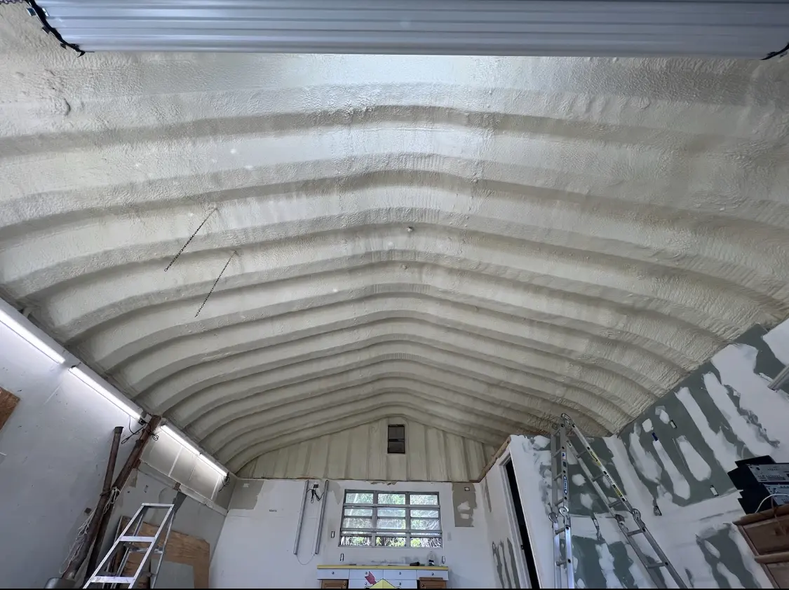 Spray polyurethane foam applied to the underside of a metal roof deck in Elk River